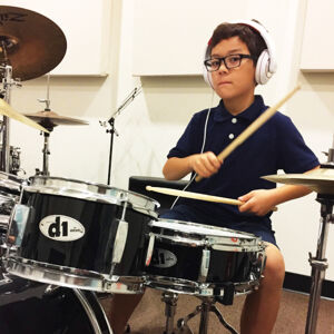 Child in a drum lesson