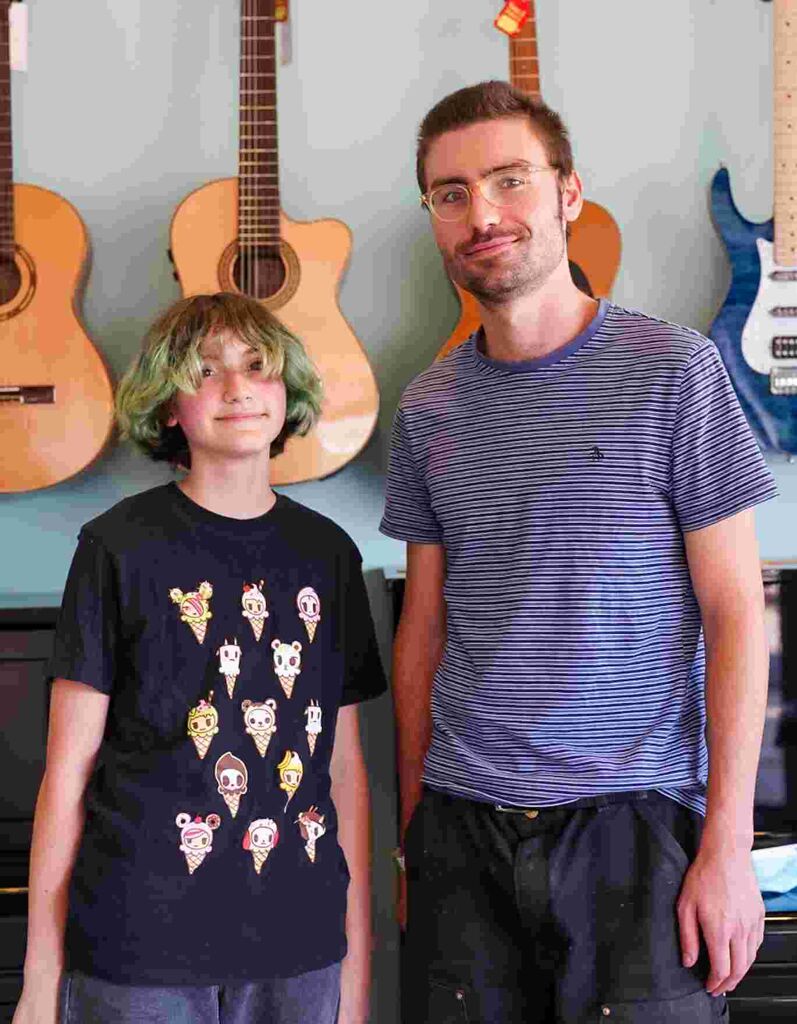 Guitar student, Finn P. with their instructor, Mr. Lukas. 